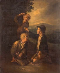 Chłopcy grają w kości kostek